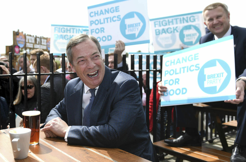 MEP, Nigel Farage reacts, at the Moon and Starfish public house during a walkabout and rally in Clacton, Essex, England for his Brexit Party Wednesday April 24, 2019. (Joe Giddens/PA via AP)