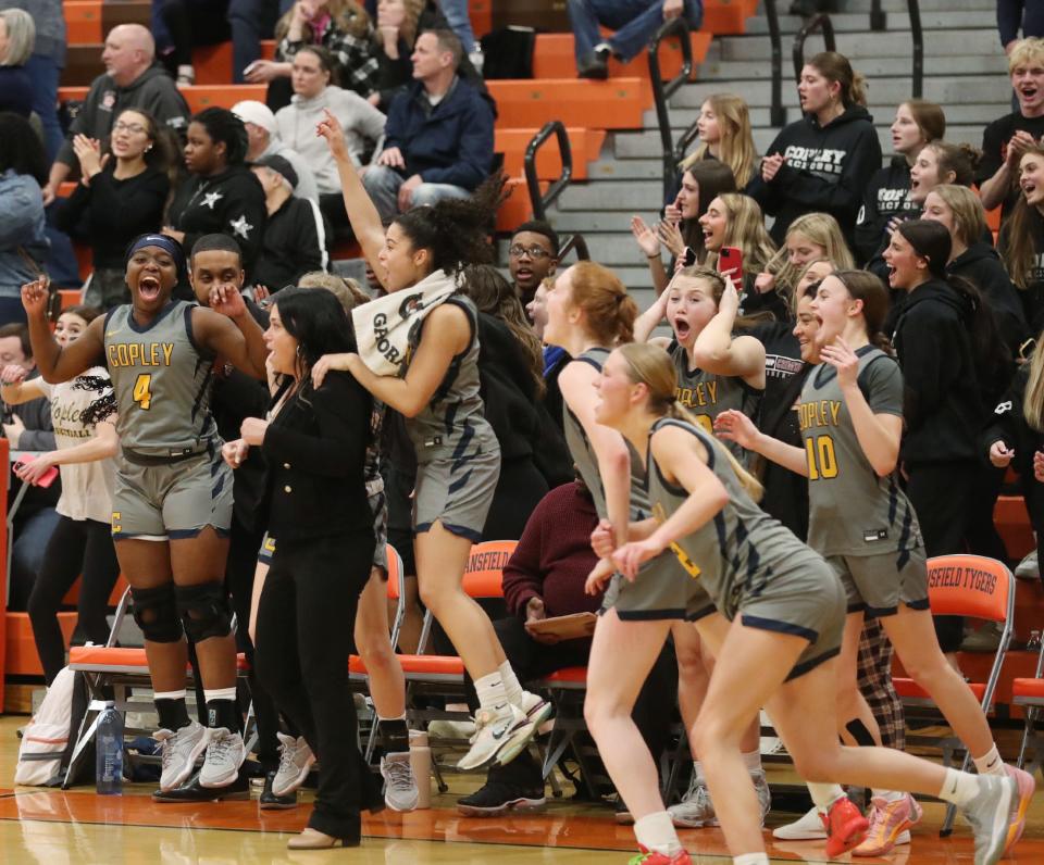 Copley girls celebrate their victory over Bryan in the OHSAA Division II Regional final game at Mansfield High School on Friday March 8, 2024.