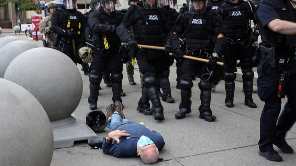 Mr Gugino was knocked to the ground by police and then lay on the ground with blood pouring from his head as officers passed him