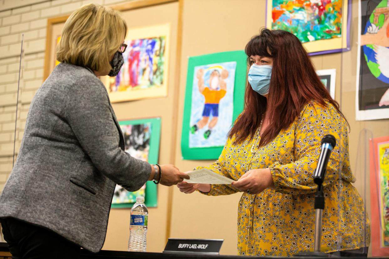 Buffy Lael-Wolf, right, is welcomed to the school board representing Subdistrict 5 by District 186 Superintendent Jennifer Gill during a school board meeting at the District 186 Administrative Center in Springfield, Ill., Monday, May 3, 2021. [Justin L. Fowler/The State Journal-Register] 