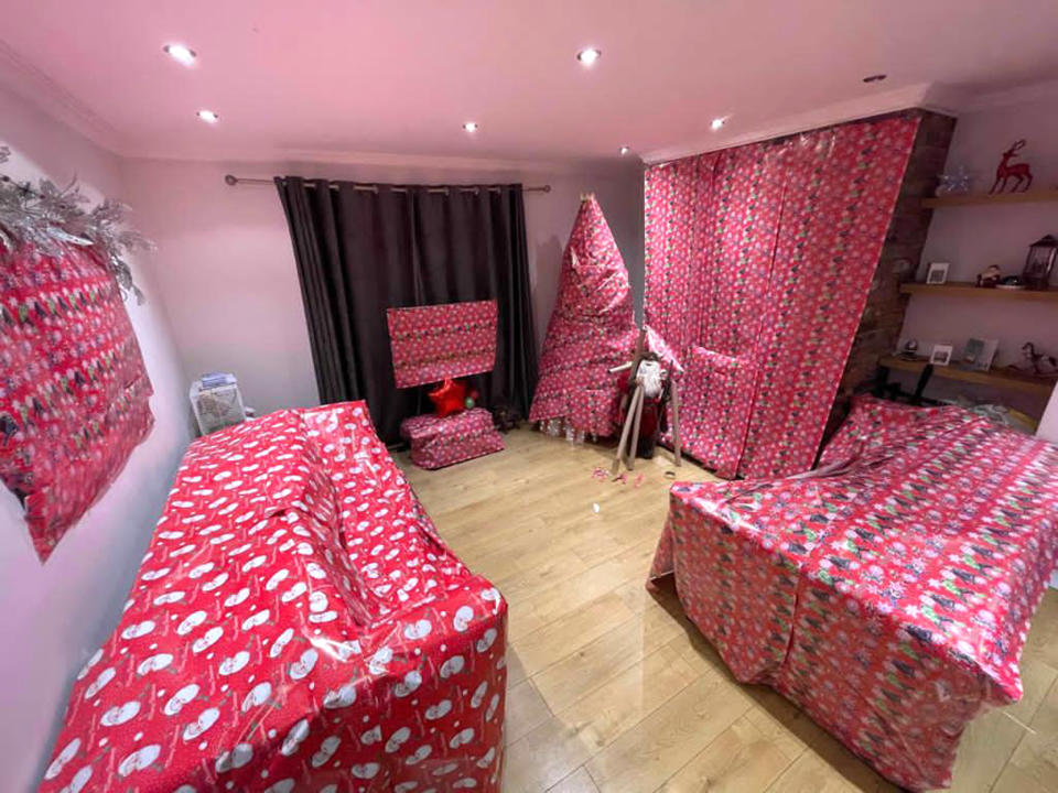 CATERS NEWS - (PICTURED Jade Mcdonald, 38, spent two hours wrapping her living room in wrapping paper with her daughter Nikita, 20) Tis the season to be naughty for this step-mum of three who wrapped her living room and blamed the elves. Jade McDonald, 38, and her daughter Nikita, 20, wrapped everything but the floor in Christmas paper on December 1. They used 36 metres of paper to wrap the mirrors, TV, Christmas tree and even the sofas in their home in Bedlington, Northumberland. Little Lucas, five and his sister Lexi Proctor, six, were shocked yet upset with their elves Socks and Eddie for making a mess - that they had to clean up. SEE CATERS COPY