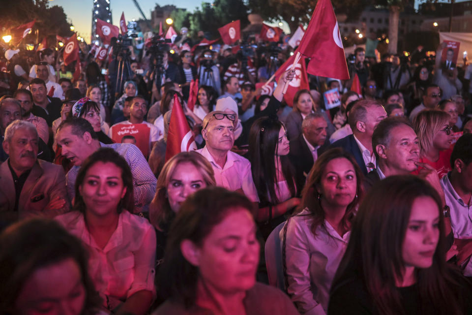 Supporters of Tunisian presidential candidate Nabil Karoui attend a rally on the last day of campaigning before the second round of the presidential elections, in Tunis, Tunisia, Friday, Oct. 11, 2019. (AP Photo/Mosa'ab Elshamy)