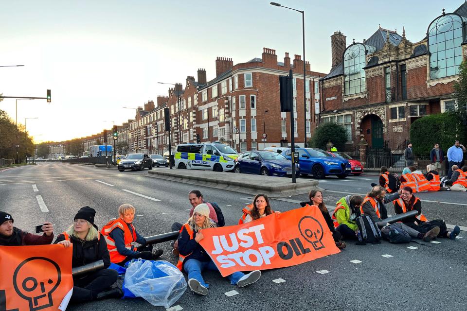 Activists have blocked a road outside Barons Court in west London (AFP via Getty Images)