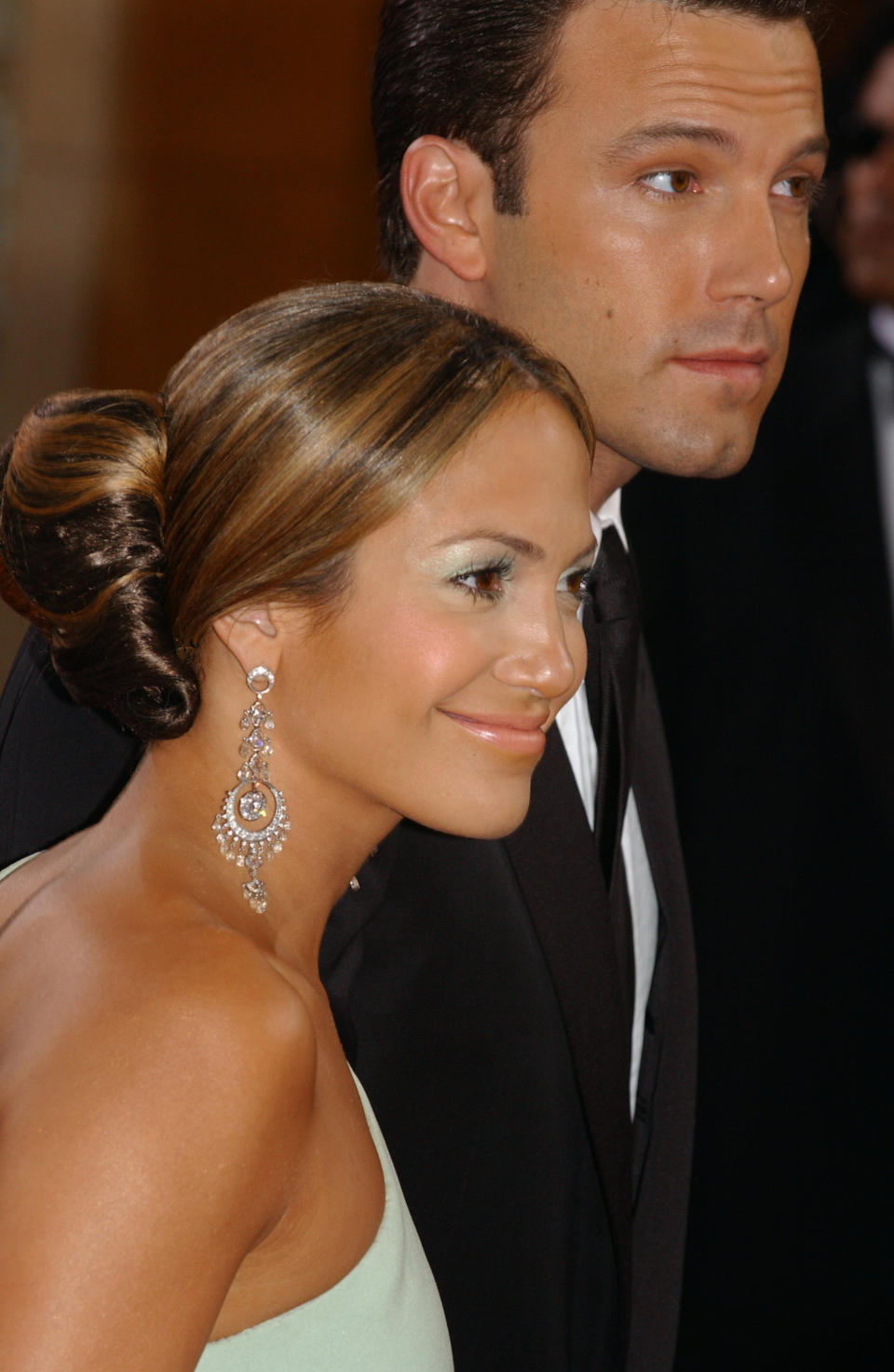 Jennifer Lopez (diamond earrings by Fred Leighton) and Ben Affleck arriving at the 75th Annual Academy Awards. (Photo by Frank Trapper/Corbis via Getty Images)