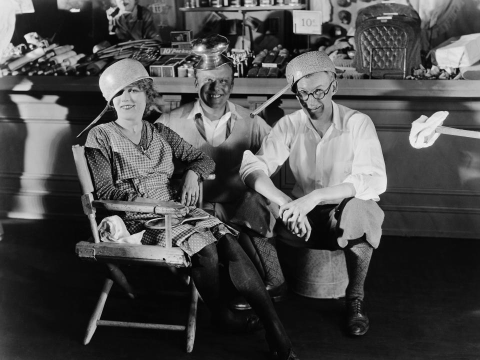 Charles Rosher (center) alongside actress Mary Pickford.