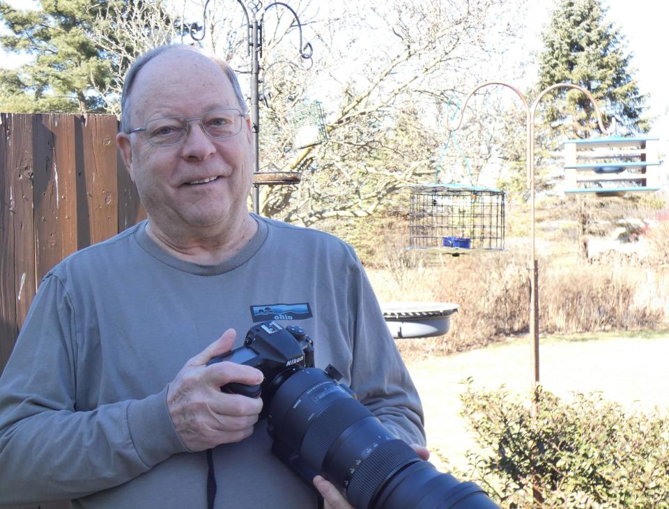 Mark Blum of Galion enjoys combining his two hobbies, taking photographs and feeding bluebirds.