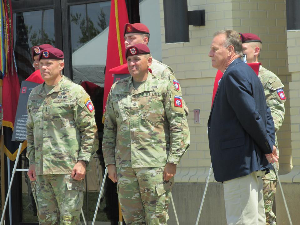 Retired Command Sgt. Maj. Ricky Yates, far right, is congratulated by  Maj. Gen. Christopher LaNeve, far left and Command Sgt. Maj. Randolph Delapena, second from right, after being inducted into the 82nd Airborne Division Hall of Fame during a ceremony Wednesday, May 24, 2023, at Fort Bragg.