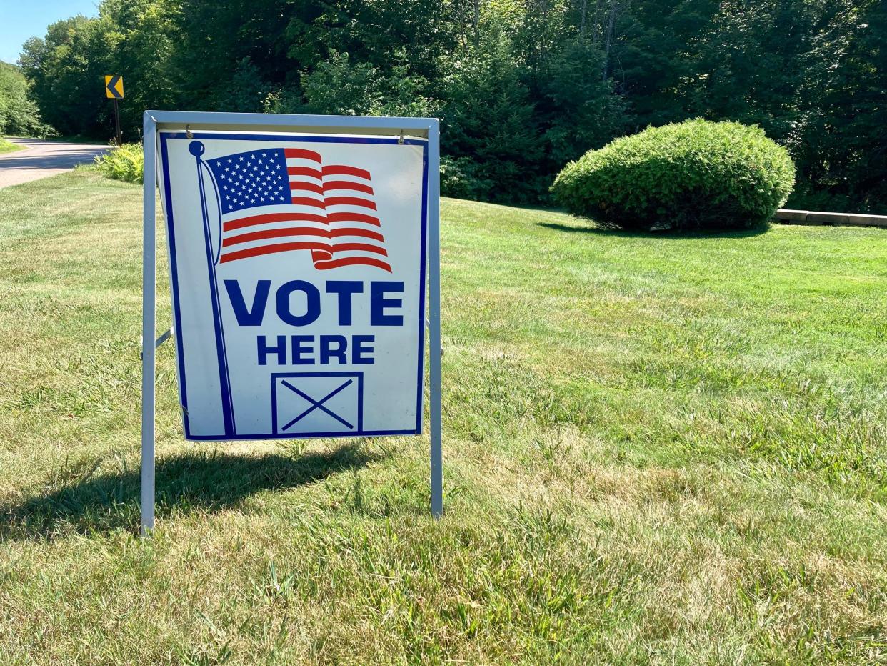 A sign outside the Harbor Springs Township Hall at 8288 S. Pleasantview Road indicates that the location is a polling place.