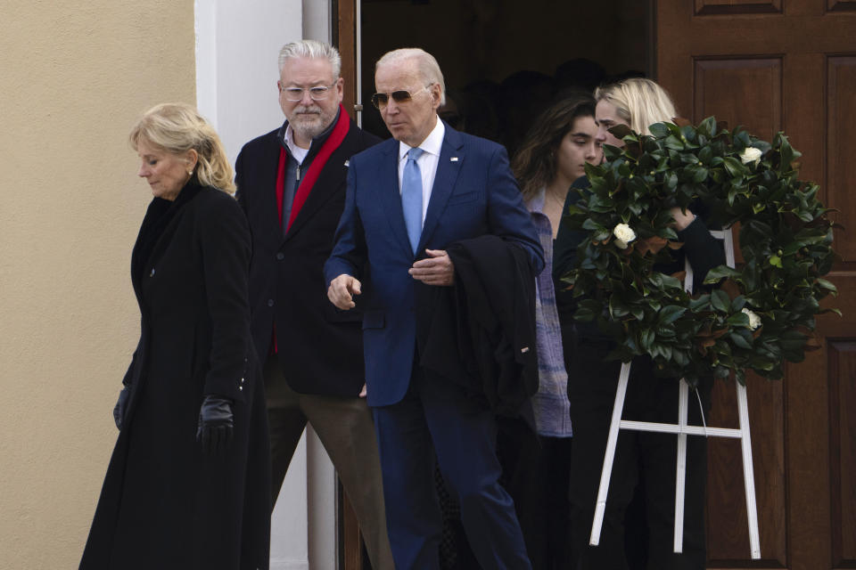 President Joe Biden and first lady Jill Biden followed by granddaughter Maisy Biden carrying a wreath as they leave St. Joseph on the Brandywine Catholic Church in Wilmington, Del., after attending Mass on Sunday, Dec. 18, 2022. Sunday marks the 50th anniversary of the car crash that killed Biden's first wife Neilia Hunter Biden and 13-month-old daughter Naomi. (AP Photo/Manuel Balce Ceneta)