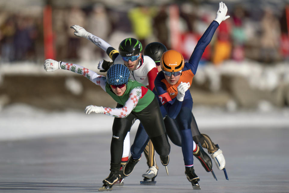 In this photo provided by the IOC, Varvara Bandaryna, of Belarus, front, Myrthe De Boer, of Netherlands, right, and Lukas Stekly, of the Czech Republic, fight for position during heat 5of the Speed Skating Mixed NOC Team Sprint event of the 2020 Winter Youth Olympic Games in St. Moritz, Switzerland, Wednesday, Jan. 15, 2020. (Thomas Lovelock for OIS via AP)