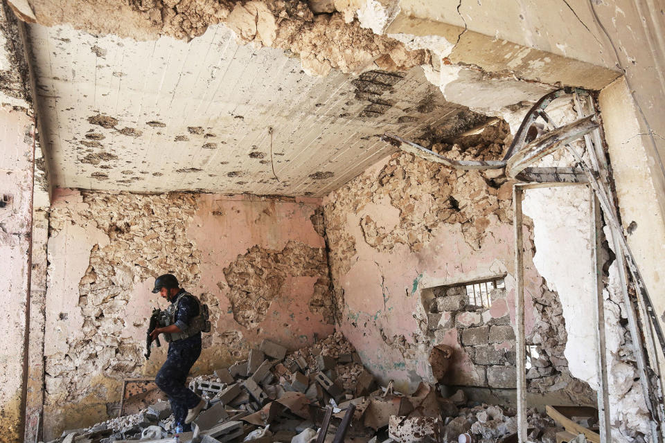 A Iraqi forces member patrols