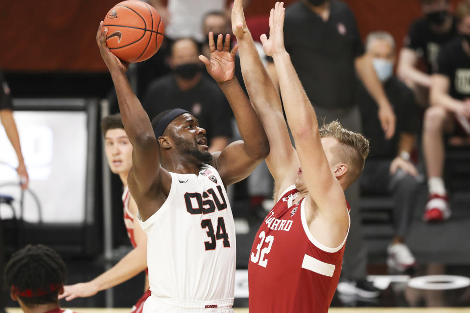 Oregon State's Rodrigue Andela (34) shoots over Stanford's Lukas Kisunas (32) during the first half of an NCAA college basketball game in Corvallis, Ore., Monday, Jan. 4, 2021. (AP Photo/Amanda Loman)