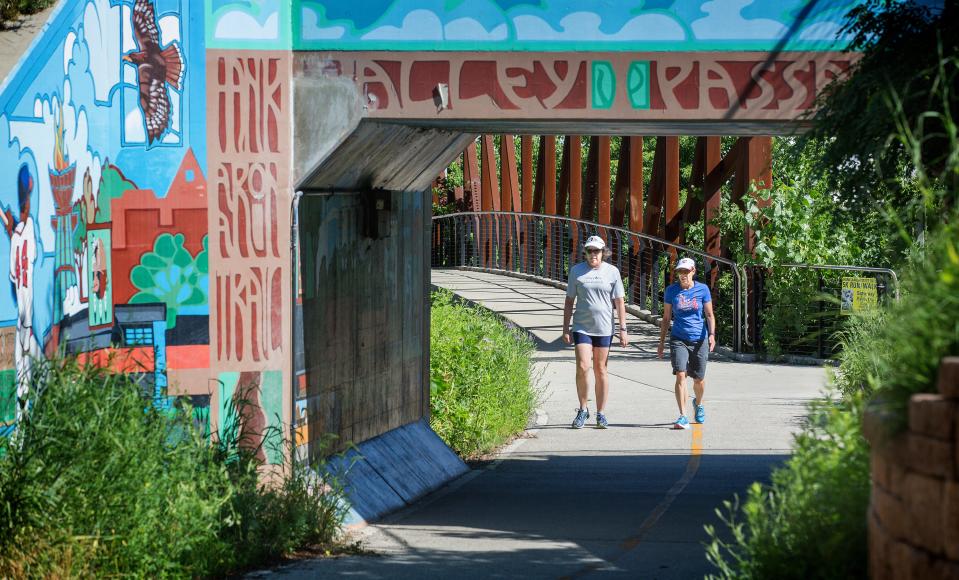 Nancy White, left, of Milwaukee, and Mary Joy Hubbs, of Muskego, walk along the Hank Aaron State Trail near the Urban Ecology Center in the Menomonee Valley in 2017.