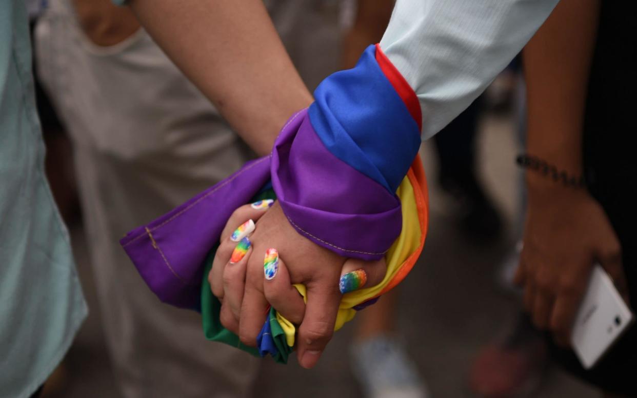 A High Court judge has ruled that a marriage between a woman and a trans man was void because both parties were legally female during the ceremony.   - AFP