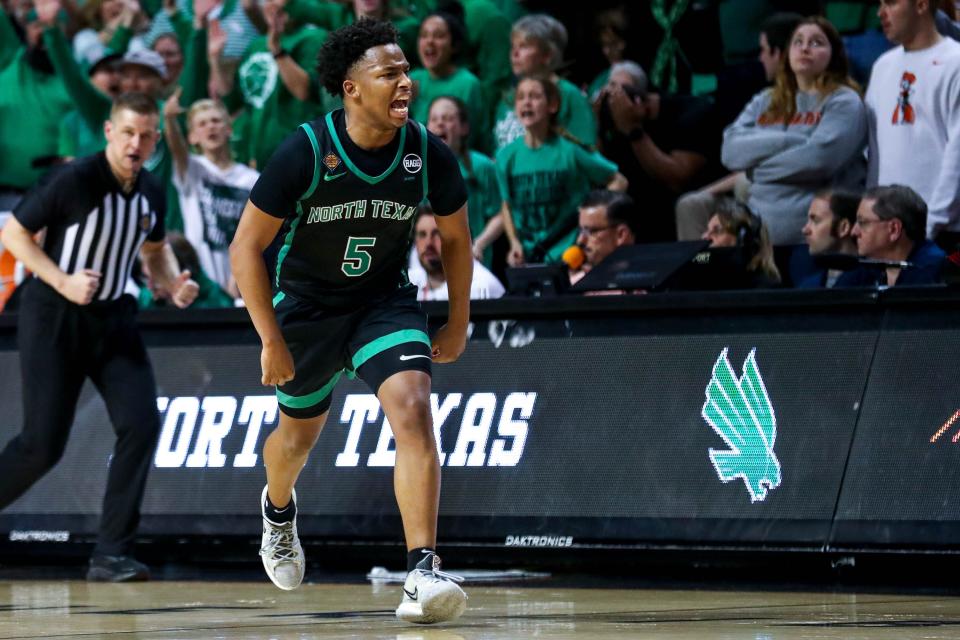 North Texas guard Tylor Perry (5) celebrates in overtime during a 65-59 win against Oklahoma State in the NIT quarterfinals at Gallagher-Iba Arena in Stillwater.