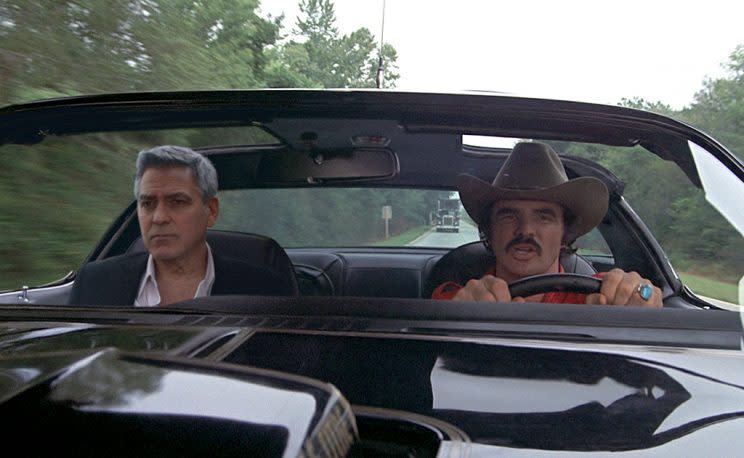 George Clooney rides shotgun alongside Burt Reynolds in a new Nespresso commercial. (Photo: Rainer Hosch)