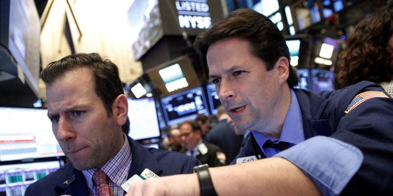 Traders work on the floor of the New York Stock Exchange (NYSE) in New York City, U.S., December 9, 2016. REUTERS/Brendan McDermid