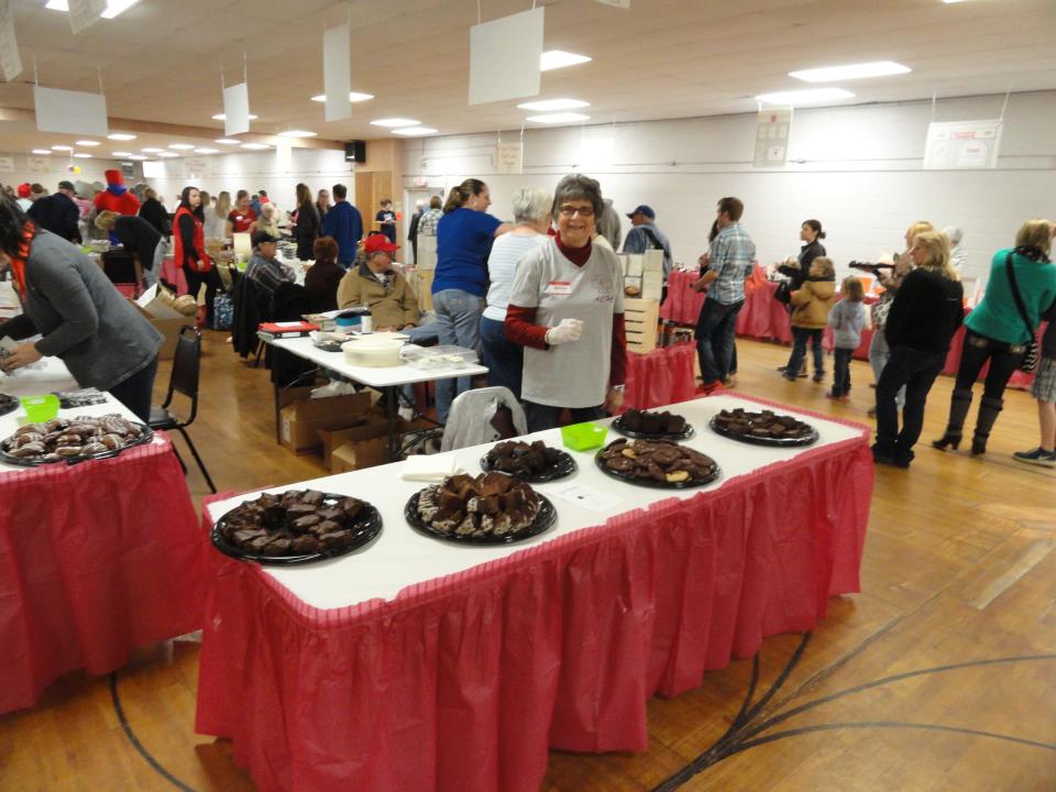Guests take a look at the thousands of available treats awaiting them at the Chocolate & More fundraiser.