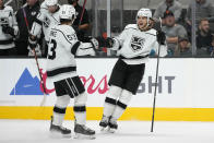 Los Angeles Kings defenseman Kale Clague, right, celebrates with Jordan Spence (53) after Clague scored a goal against the San Jose Sharks during the second period of an NHL hockey preseason game Tuesday, Sept. 28, 2021, in San Jose, Calif. (AP Photo/Tony Avelar)