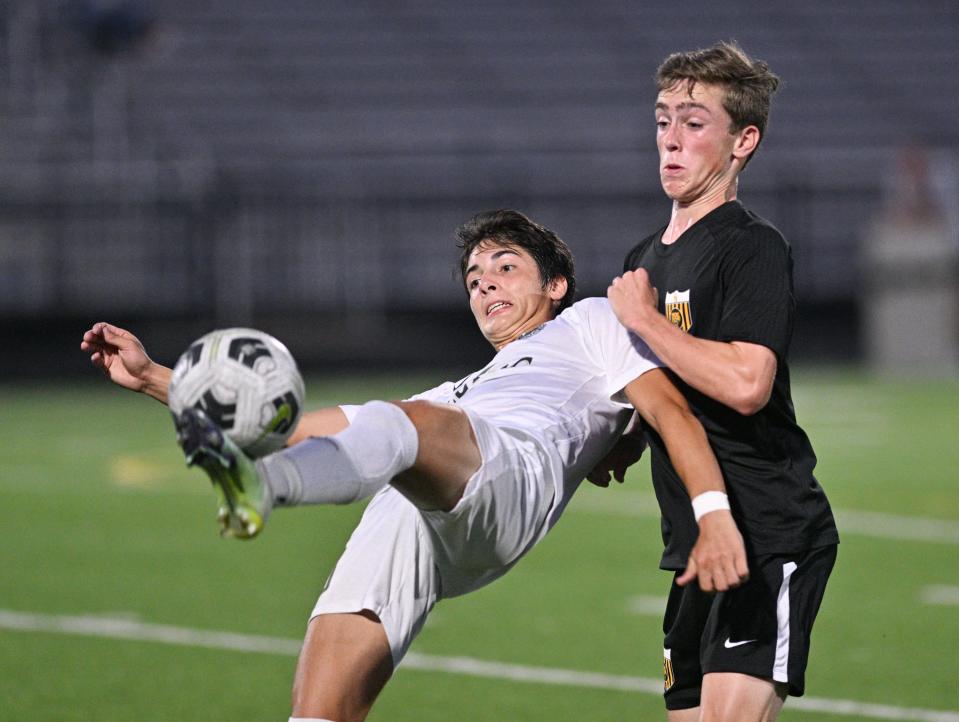 Dublin Jerome’s Jack Maust (left) and Upper Arlington’s Cooper Baltimore battle Aug. 25 at Upper Arlington.