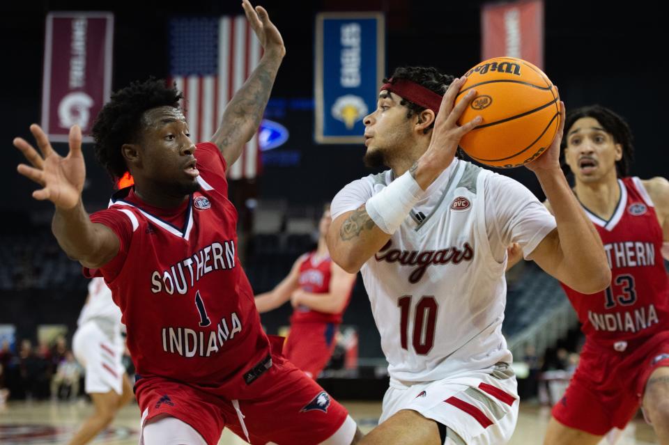 Southern Indiana’s Isaiah Swope (1) guards SIU-Edwardsville’s Jalen Hodge (10) during their game at the Ford Center in Evansville, Ind., on Wednesday, March 1, 2023.