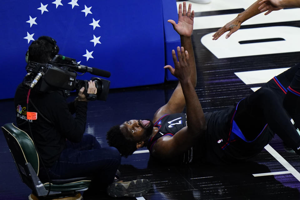 Philadelphia 76ers' Joel Embiid reacts after being fouled during the first half of Game 2 in a first-round NBA basketball playoff series against the Washington Wizards, Wednesday, May 26, 2021, in Philadelphia. (AP Photo/Matt Slocum)