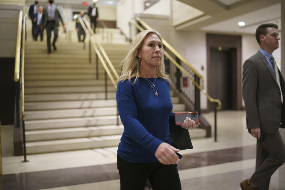 Rep. Marjorie Taylor Greene, R-Ga., and fellow Republicans arrive for a meeting to consider a replacement for Rep. Liz Cheney, R-Wyo., was ousted from the GOP leadership Wednesday at the Capitol in Washington, Thursday, May 13, 2021. Republicans will vote Friday morning for a new chair for the House Republican Conference. (AP Photo/J. Scott Applewhite)