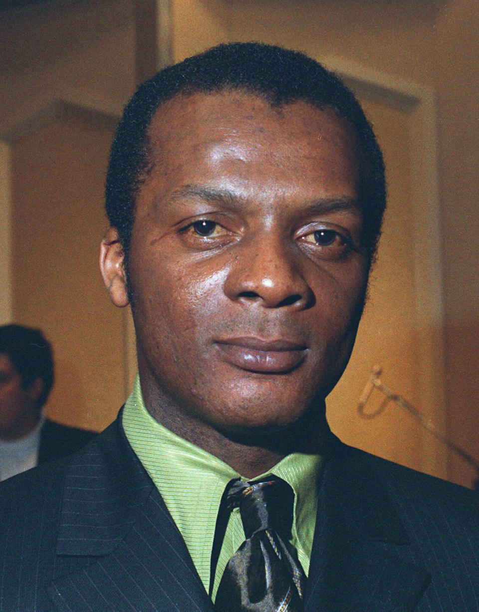 FILE-- Curt Flood, shown in this 1970 file photo, the star center fielder of the St. Louis Cardinals who challenged baseball's reserve system all the way to the U.S. Supreme Court. Flood set off the free-agent revolution 50 years ago Tuesday, Dec. 24, 2019, with a 128-word letter to baseball Commissioner Bowie Kuhn, two paragraphs that pretty much ended the career of a World Series champion regarded as among the sport's stars but united a union behind his cause. (AP Photo/file)