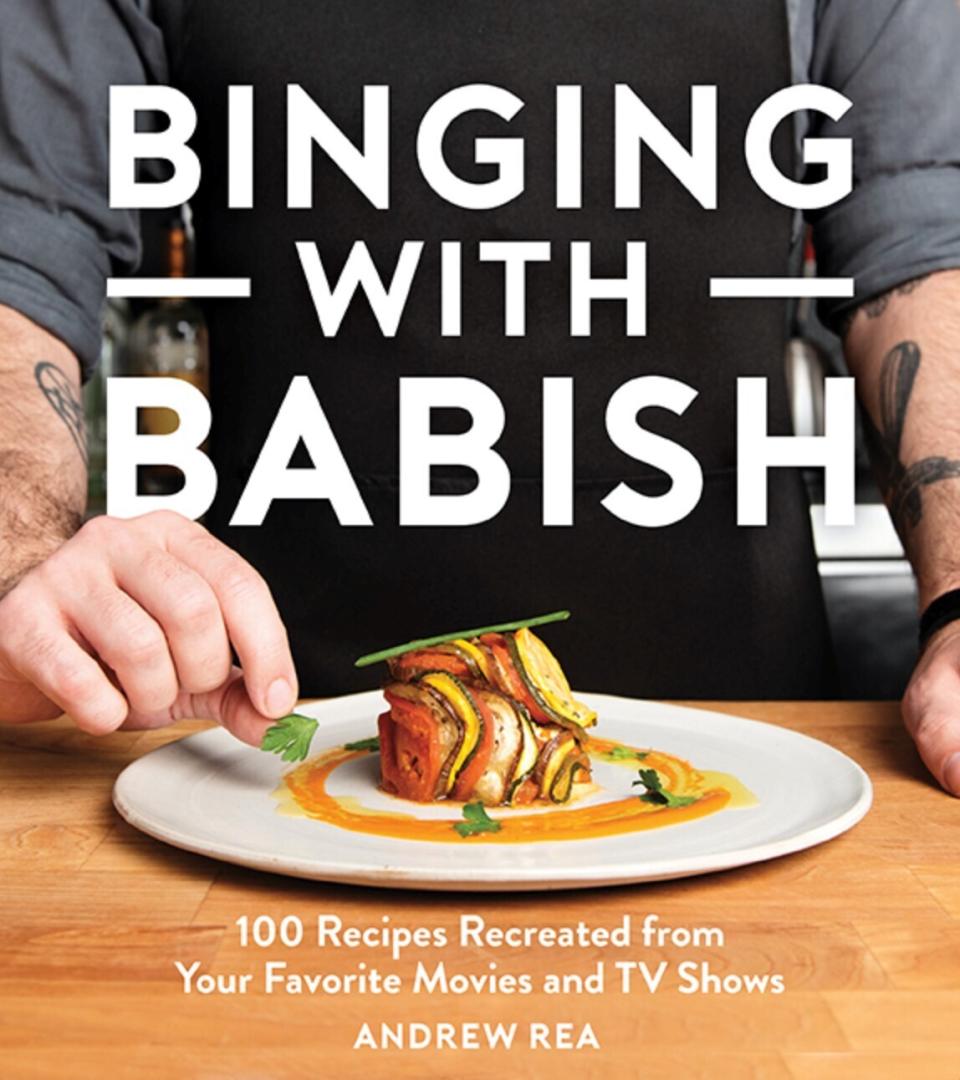 This cover image released by Houghton Mifflin Harcourt shows "Binging with Babish: 100 Recipes Recreated from Your Favorite Movies and TV Shows," by Andrew Rea. (Houghton Mifflin Harcourt via AP)