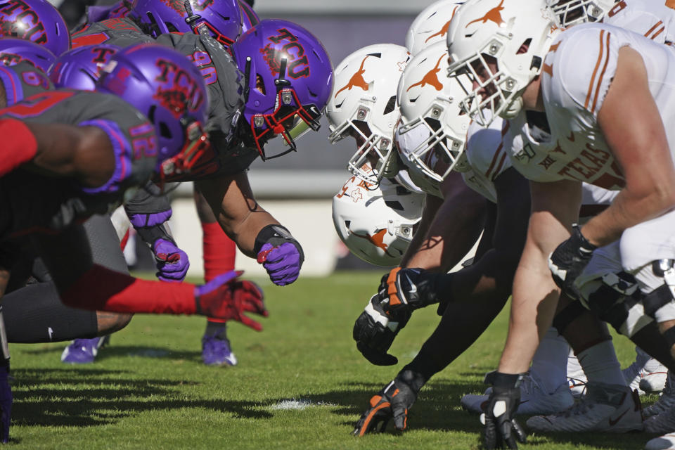 TCU and Texas linemen square off at the line of scrimmage on an extra point try in the first half of an NCAA college football game in Fort Worth, Texas, Saturday, Oct. 26, 2019. (AP Photo/Louis DeLuca)