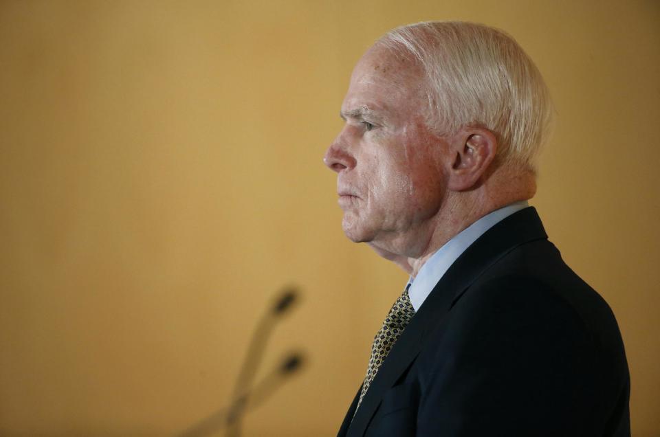 Sen. John McCain listens to complaints from veterans during a forum with veterans on Friday, May 9, 2014, in Phoenix. McCain was discussing lapses in care at the Phoenix Veterans Affairs hospital that prompted a national review of operations around the country. (AP Photo/Matt York)