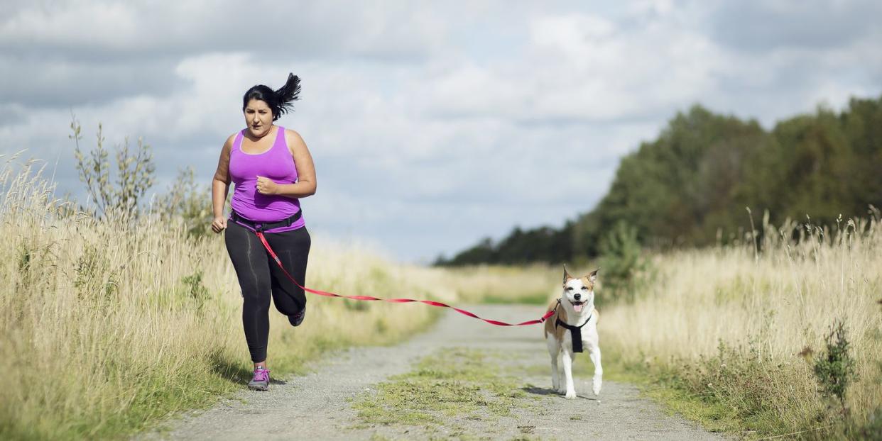 woman running with dog