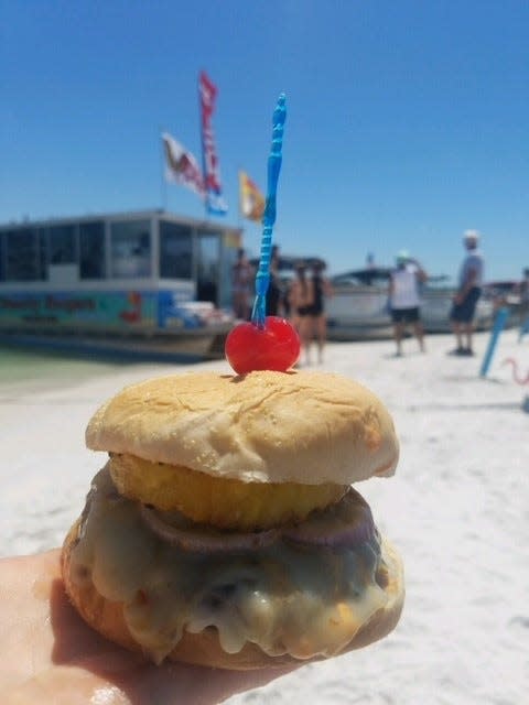 Just Beachy Burgers "Island" burger ($13) on Keewaydin Island was featured on Food Network's Best "Food Boats" episode.