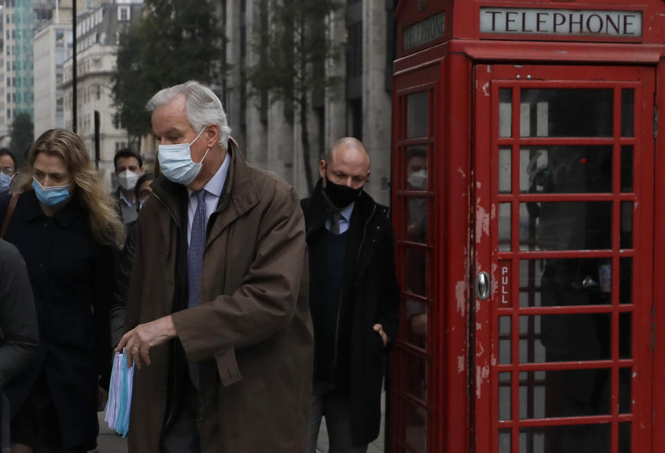 EU Chief Negotiator Michel Barnier walks to a conference centre in Westminster in London, Sunday, Nov. 29, 2020. Teams from Britain and the European Union are continuing face-to-face talks on a post-Brexit trade deal in the little remaining time. (AP Photo/Kirsty Wigglesworth)