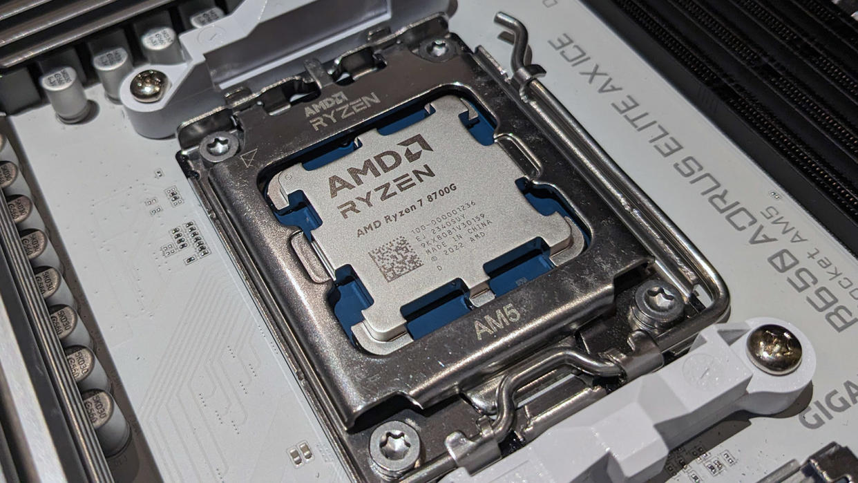  AMD Ryzen 7 8700G CPU in socket. 