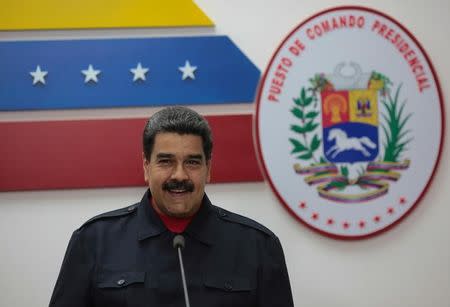 Venezuela's President Nicolas Maduro smiles during a meeting with government members at the Miraflores Palace in Caracas, Venezuela October 15, 2017. Miraflores Palace/Handout via REUTERS