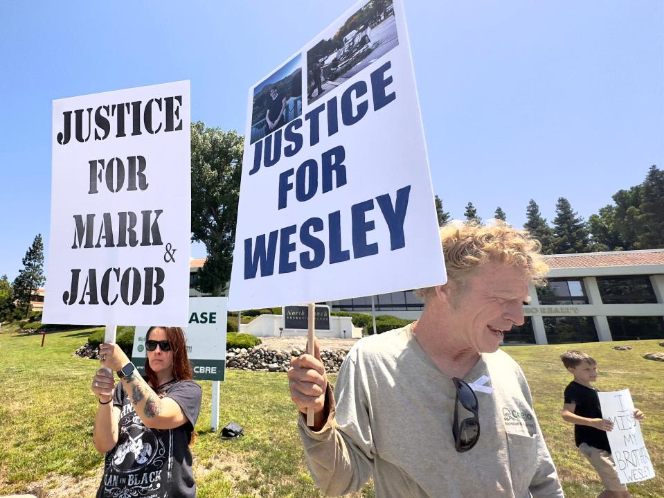 Kelly Welling, from left, and Craig Welling, parents of Wesley Welling, attend the "stand up for victims" event at the corner of Westlake and Thousand Oaks boulevards June 30. In April, their son Wesley, 15, was killed after being struck by a car while he was standing at a bus stop near Westlake High School in Thousand Oaks.