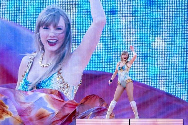 Taylor Swift wears a glittery leotard on stage