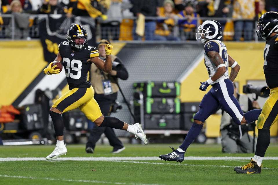 Pittsburgh Steelers free safety Minkah Fitzpatrick (39) heads for the end zone for a touchdown after intercepting a pass from Los Angeles Rams quarterback Jared Goff (not shown) during the first half of an NFL football game in Pittsburgh, Sunday, Nov. 10, 2019. (AP Photo/Keith Srakocic)