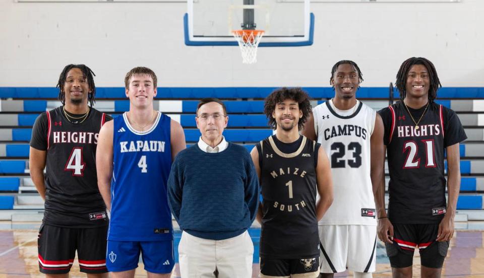 The 2024 Wichita Eagle All-Metro boys basketball team. From left to right: Heights’ TJ Williams, Kapaun’s Will Thengvall, Kapaun coach Steve Eck, Maize South’s Michael Kates, Campus’ Andrell Burton Jr. and Heights’ Amalachi Wilkins. Not pictured: Maize South’s Tory Homan.