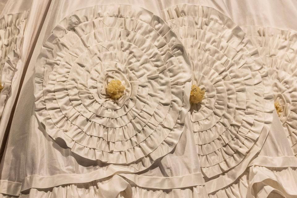 A close-up of the appliqués of a replica of Ann Lowe's Wedding Dress worn by Jacqueline Bouvier in her wedding to John F. Kennedy is featured during a preview of the "Ann Lowe: American Couturier" exhibition at the Winterthur Museum, Garden and Library near Centreville, Wednesday, Aug. 30, 2023. The exhibit features 40 gowns and runs from Sept. 9 to Jan. 7, 2024.