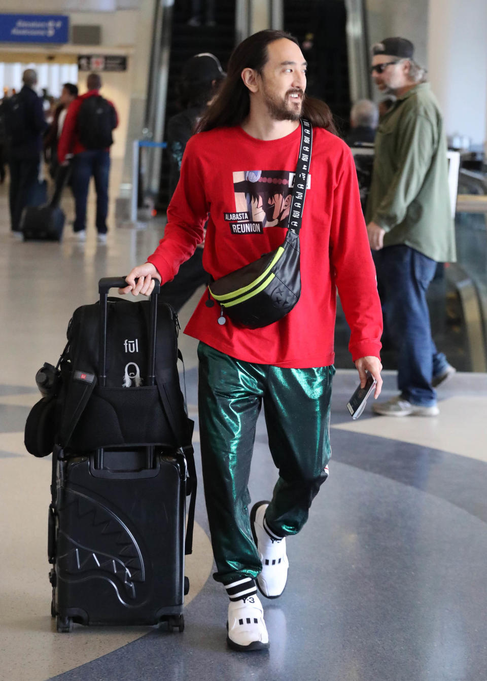 DJ Steve Aoki mid-travel at LAX.