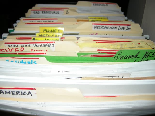 In this undated image released by Heather Brookes Interior Organization, various files are shown before a home office organization project. (AP Photo/Heather Brookes Interior Organization)