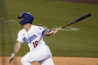 Los Angeles Dodgers' Will Smith watches his RBI single during the first inning of the team's baseball game against the Oakland Athletics on Thursday, Sept. 24, 2020, in Los Angeles. (AP Photo/Marcio Jose Sanchez)