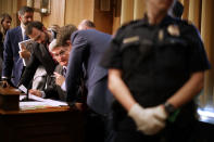 <p>Sen. Bill Cassidy (R-LA) talks with members of his staff as protesters interrupt a hearing of the Senate Finance Committee about the proposed Graham-Cassidy healthcare bill in the Dirksen Senate Office Building on Capitol Hill September 25, 2017 in Washington, DC. Demonstrators disrupted the hearing to protest the legislation, the next in a series of Republican proposals to replace the Affordable Care Act, also called Obamacare. (Photo: Chip Somodevilla/Getty Images) </p>