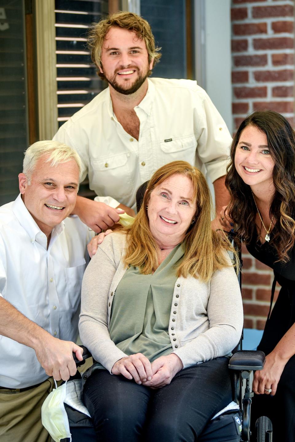 Ellen Andary, center, with her husband Michael, left, son Will and daughter Caroline, right, photographed on Friday, Aug. 14, 2020, at her home in East Lansing.