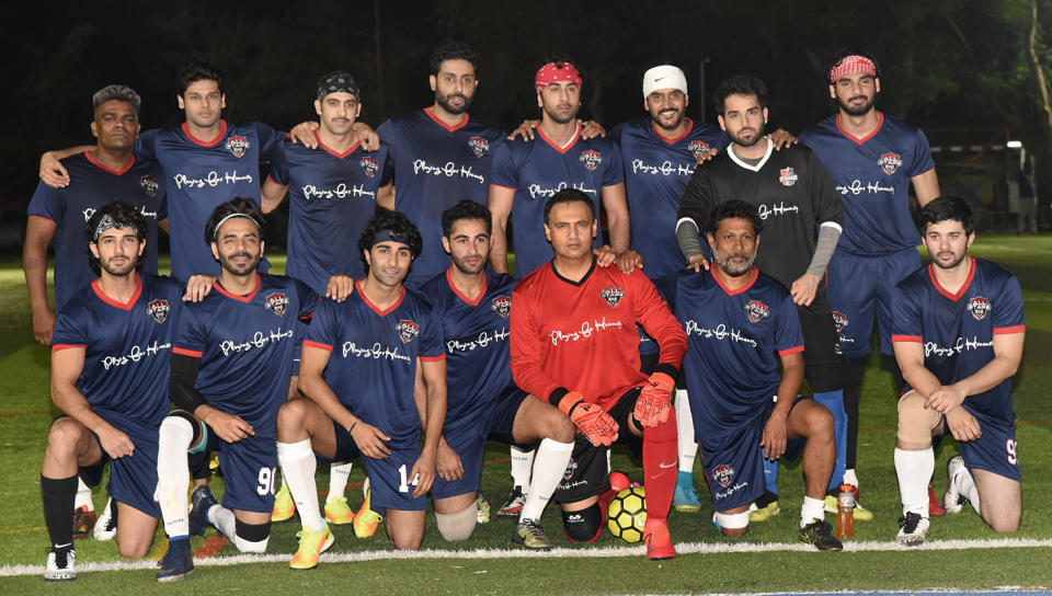 The entire team poses after the match.