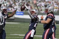 New England Patriots' James White, center, celebrates his touchdown during the first half of an NFL football game against the New York Jets, Sunday, Sept. 19, 2021, in East Rutherford, N.J. (AP Photo/Bill Kostroun)