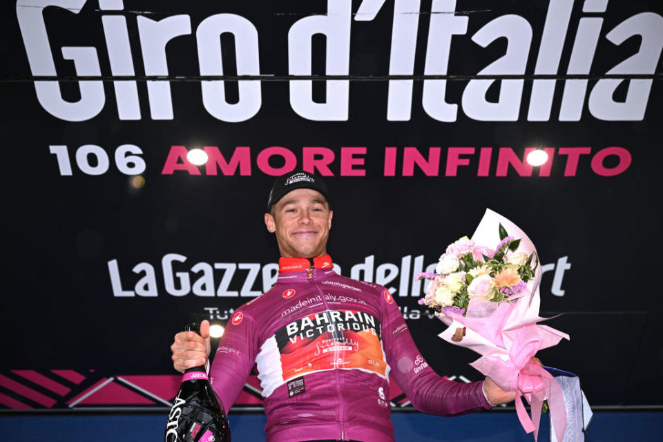 CASSANO MAGNAGO ITALY  MAY 20 Jonathan Milan of Italy and Team Bahrain  Victorious celebrates at podium as Purple Points Jersey winner during the 106th Giro dItalia 2023 Stage 14 a 194km stage from Sierre to Cassano Magnago  UCIWT  on May 20 2023 in Cassano Magnago Italy Photo by Stuart FranklinGetty Images