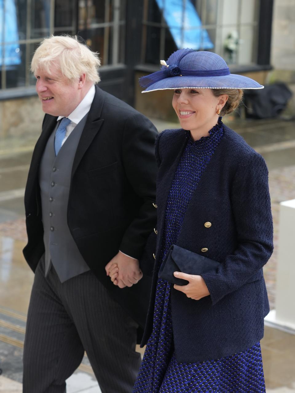 Former British Prime Minister Boris Johnson and and Carrie Johnson arrive ahead of the Coronation of King Charles III and Queen Camilla on May 6, 2023 in London, England.